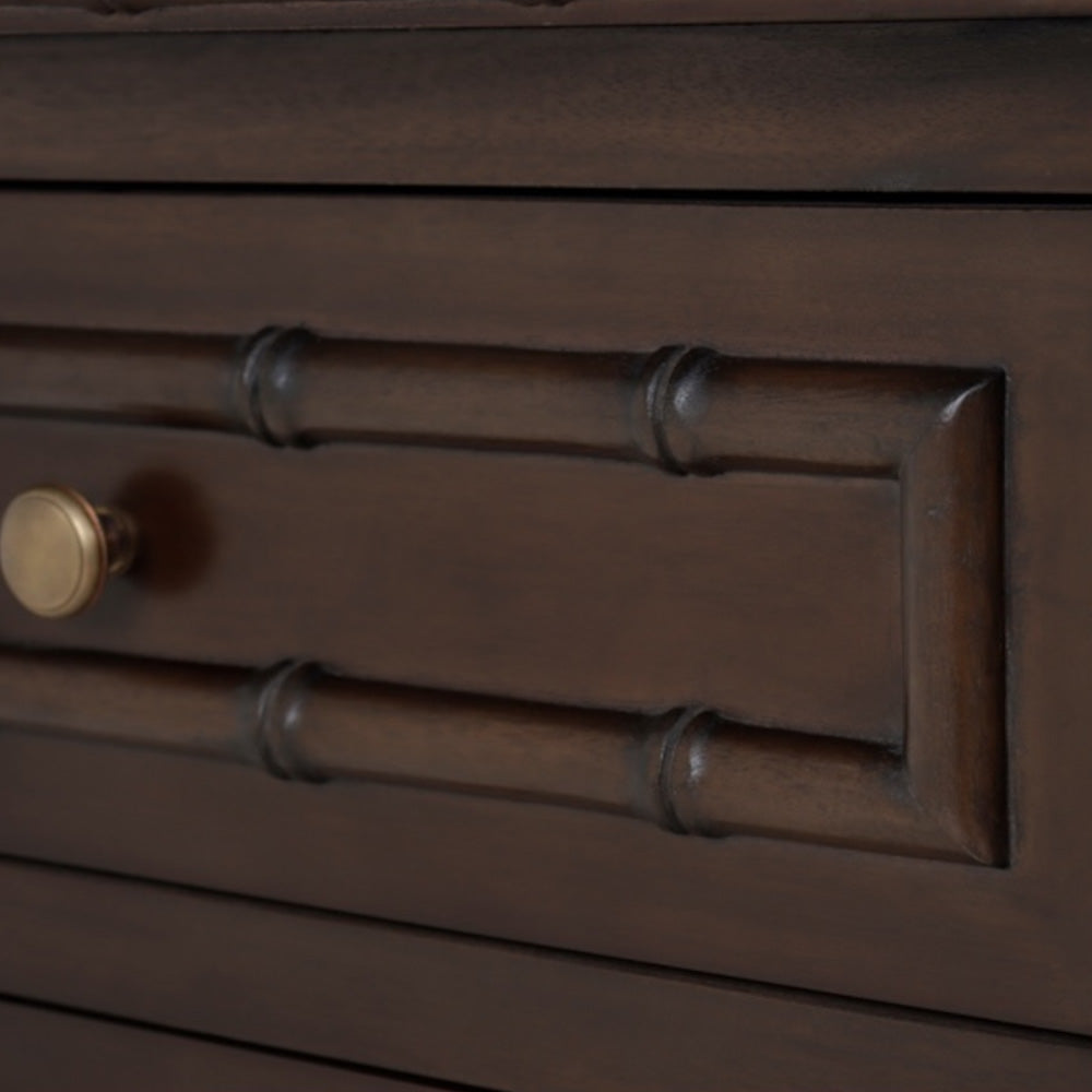 Close-up of a wooden drawer with a metal handle