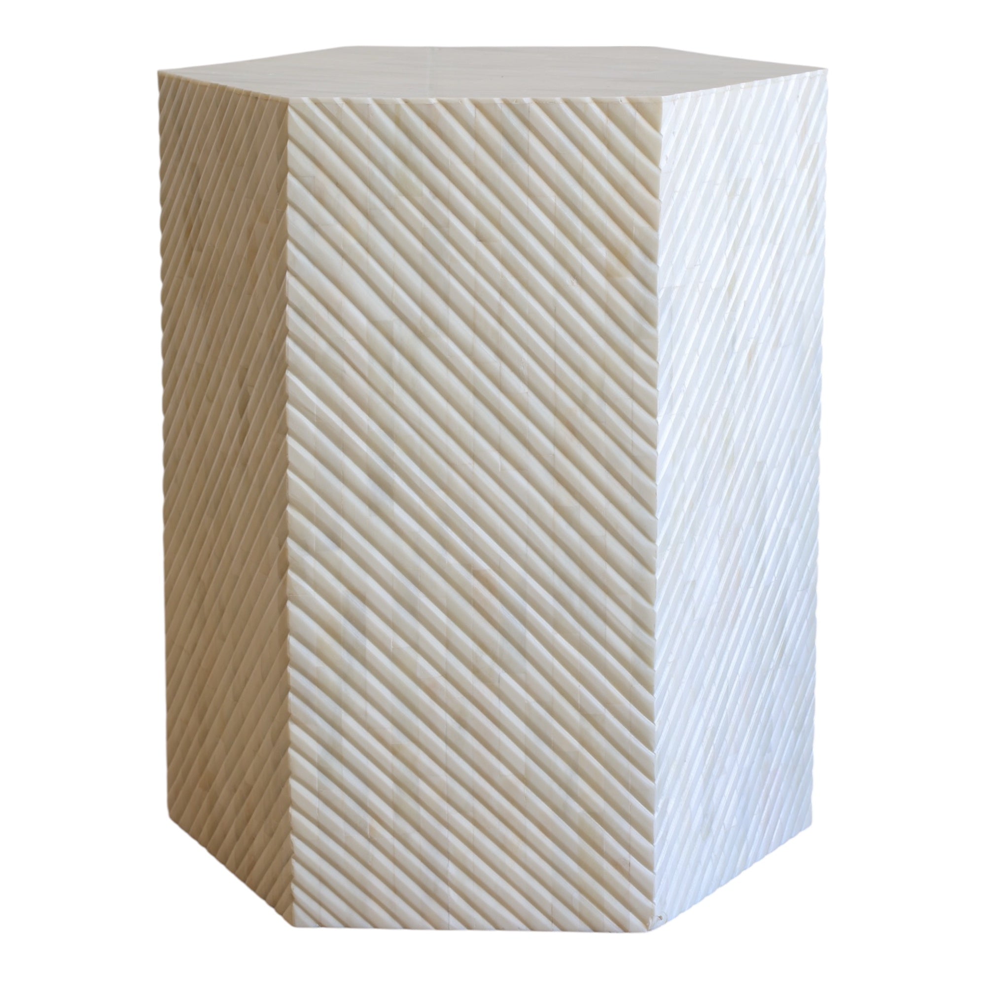 Hexagonal side table with a geometric pattern on a white background