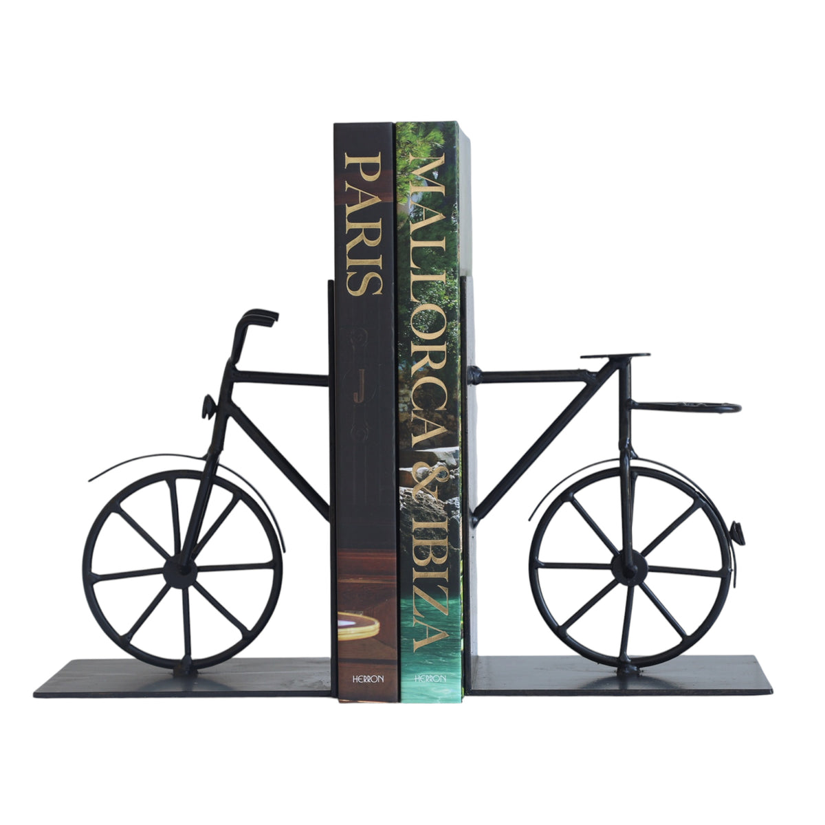 A black metal bicycle bookend shaped like a bicycle frame with two wheels and a base, holding two standing books between it on a plain white background.