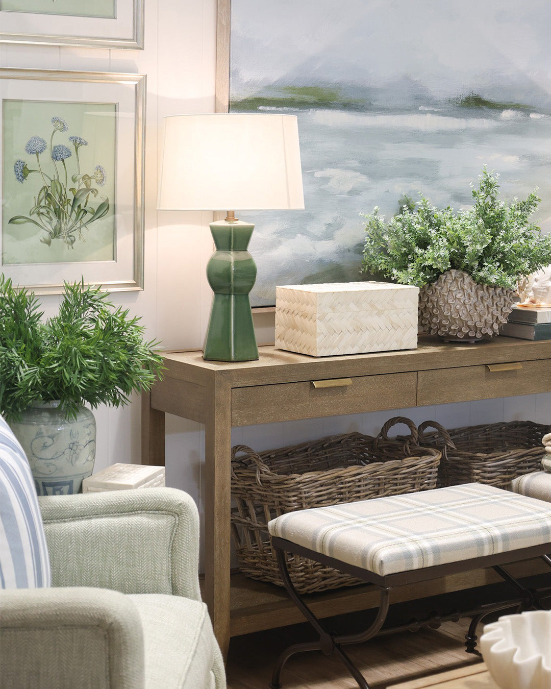 Kellie Console styled with green geometric lamp, a bone box and large textured vase of greenery. 