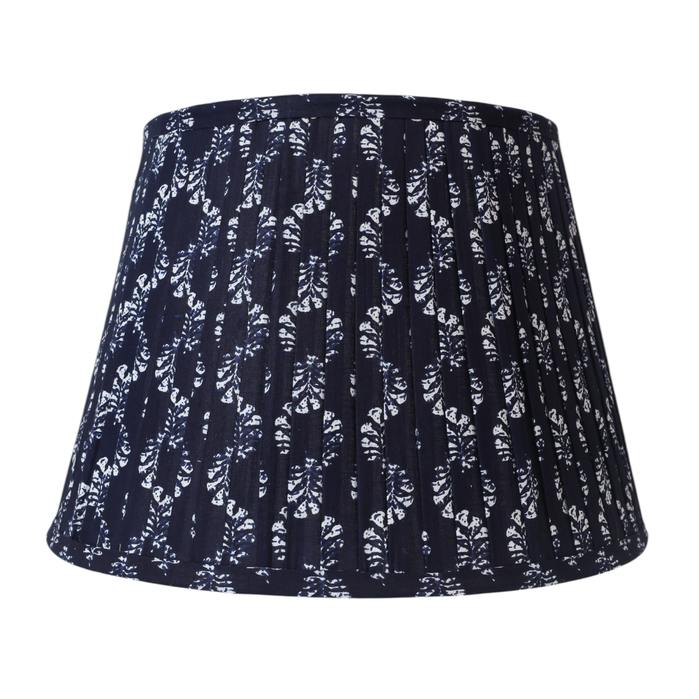 Navy blue lampshade with white abstract pattern on a white background